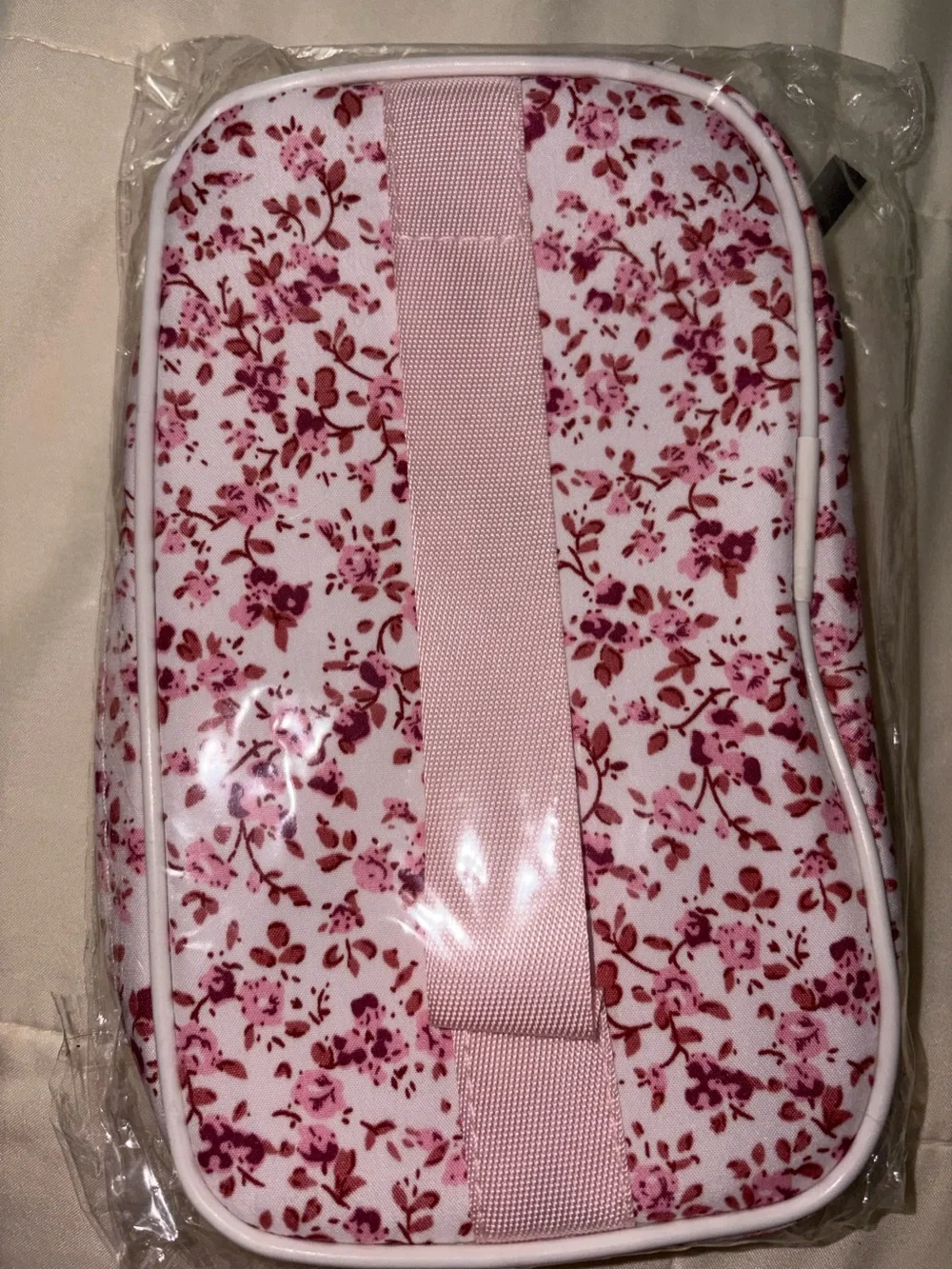 Floral print makeup bag suitable for travel and daily use.